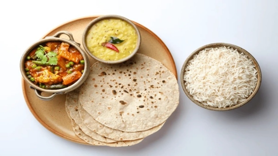 Rice and chapati ,Balanced diet, nutrients, carbohydrates, fiber, vitamins, minerals, calorie intake, energy, weight management, portion control, calorie density, fullness, digestion, digestive system, mixed grains, gut health, bowel movements, blood sugar levels, glycemic index, insulin response, diabetes management, satiety, hunger control, appetite regulation, meal satisfaction, cultural practices, traditional meals, eating habits, taste, texture, protein intake, muscle maintenance, nutrient absorption, bioavailability, healthy fats, ghee, oil, metabolism, weight gain, physical activity, heart health, cholesterol levels, dietary preferences, flexibility, complete meal, gastrointestinal health, gut microbiome, regularity, sustained energy, food allergies