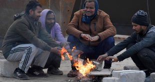 Labourers Sit Around The Bonfire